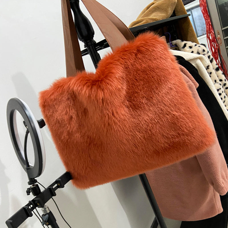 Very large furry bag with strap